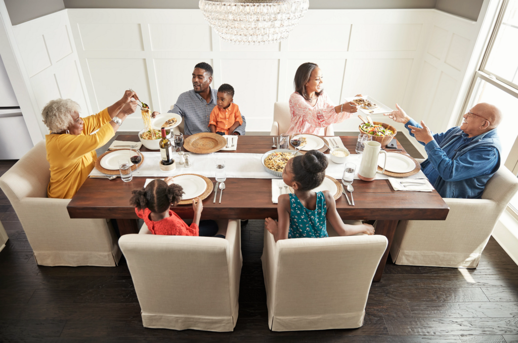 Family having breakfast at the dining table | Tish Flooring